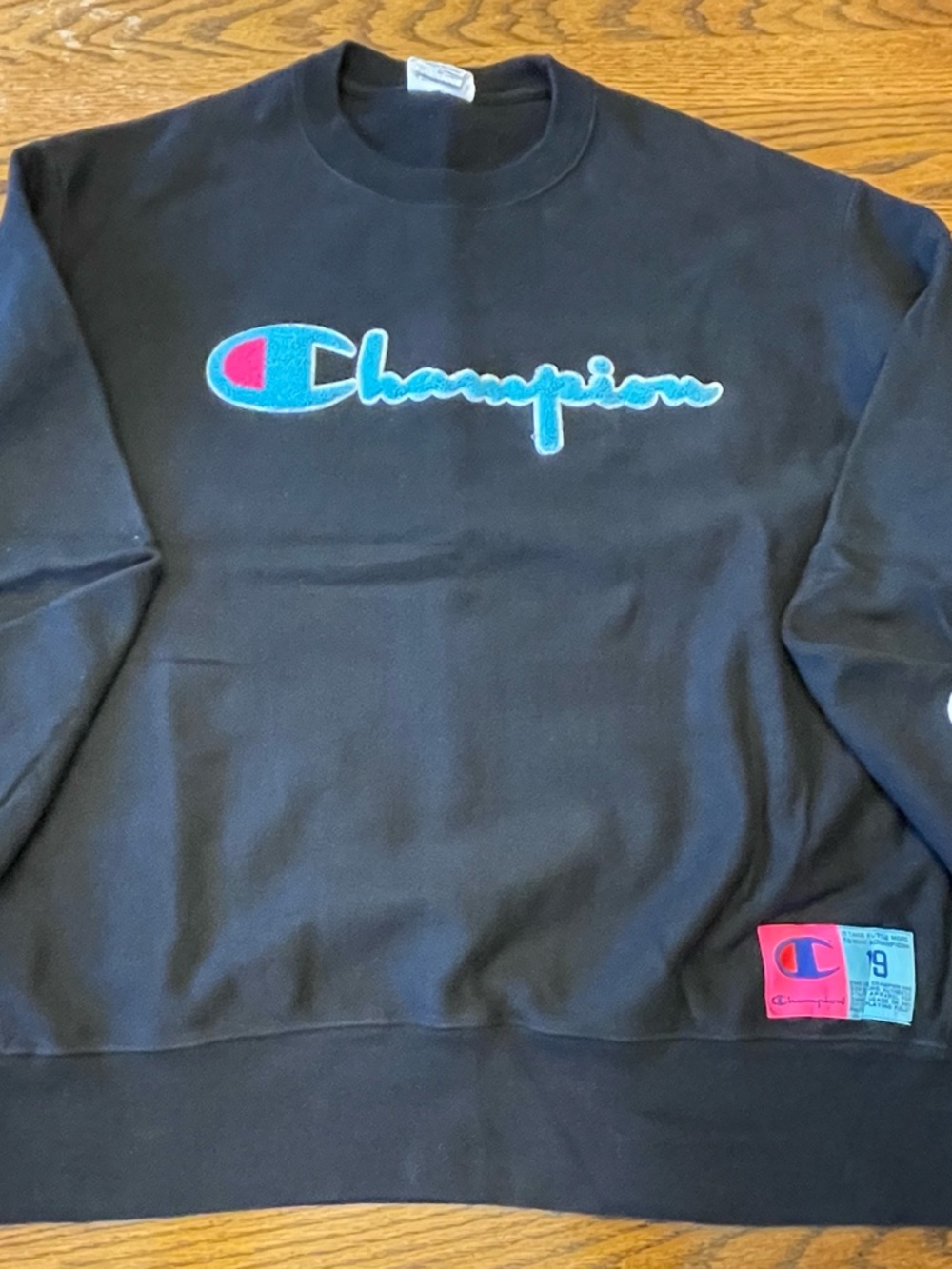 Champion Black Sweatshirt with Blue Tag Logo